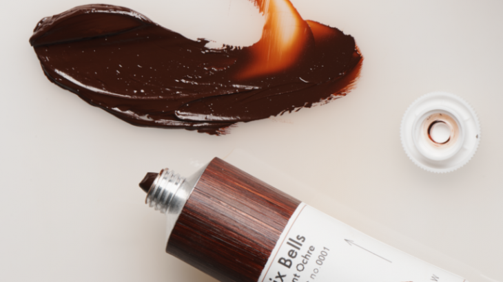 A tube of Six Bells Burnt Ochre paint