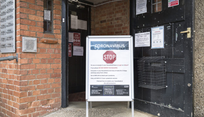 Buckingham, UK - March 30, 2020. Coronavirus COVID-19 warning sign with prevention information outside a GP doctor surgery. Credit: Paul Maguire