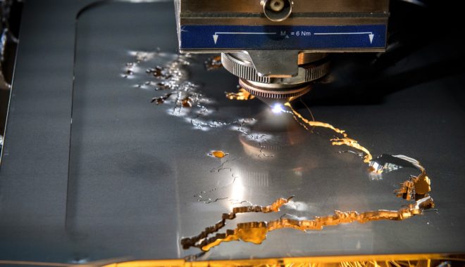 A fibre laser cutting metal at the Zepler Institute. Fibre lasers use considerably less energy than traditional methods and are a key means of decarbonising manufacturing.